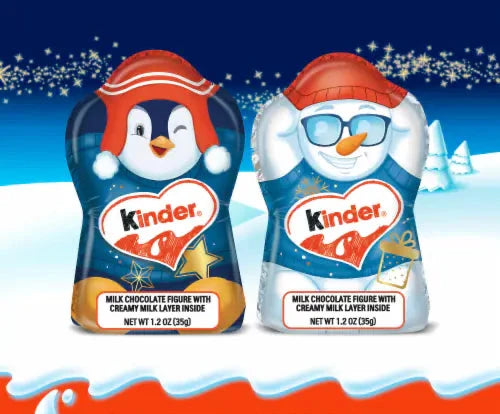 Two Kinder chocolate figures with holiday designs on a snowy background