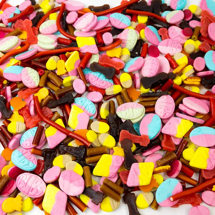 Close-up of Swedish pick-and-mix candy showcasing colorful foam sweets and licorice pieces filling the frame
