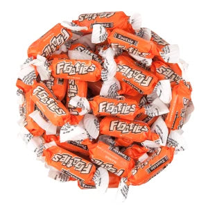 Pile of Frooties candy with orange and white packaging on a white background