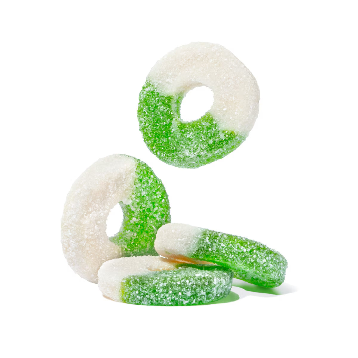 Green and white jelly candies on a white background