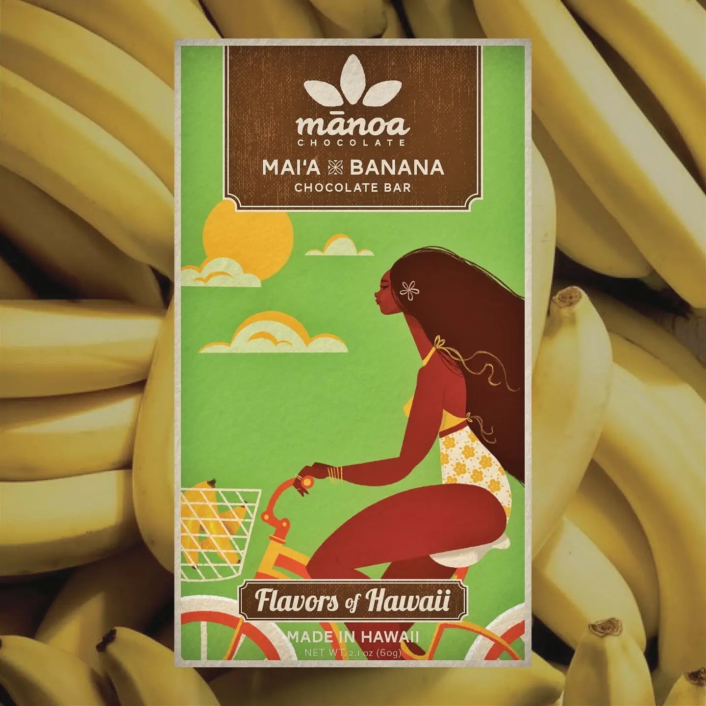 Manoa chocolate bar packaging with a woman and banana illustration on a background of bananas
