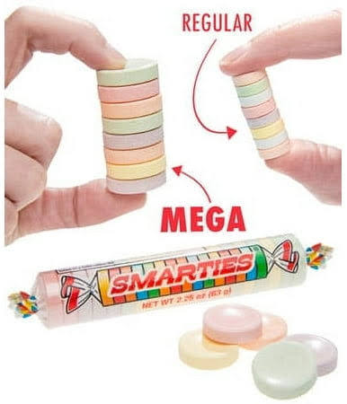 Smarties candy comparison between regular and mega sizes with hands holding the candy