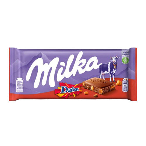 A Milka Daim chocolate bar in its original packaging, featuring a purple and red wrapper with the white 'Milka' logo, a cow illustration, and a chocolate wafer bar depicted on the front