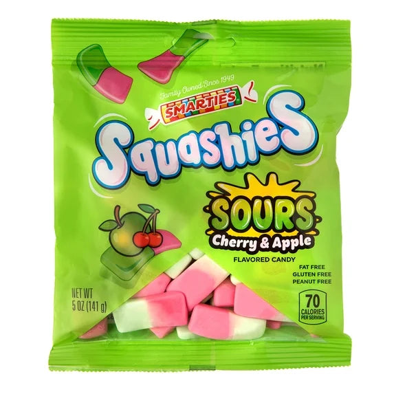 A 5 oz bag of Smarties Squashies Sours Cherry & Apple flavored candy, featuring a bright lime green packaging with pink and white triangular candy pieces visible through a clear window at the bottom