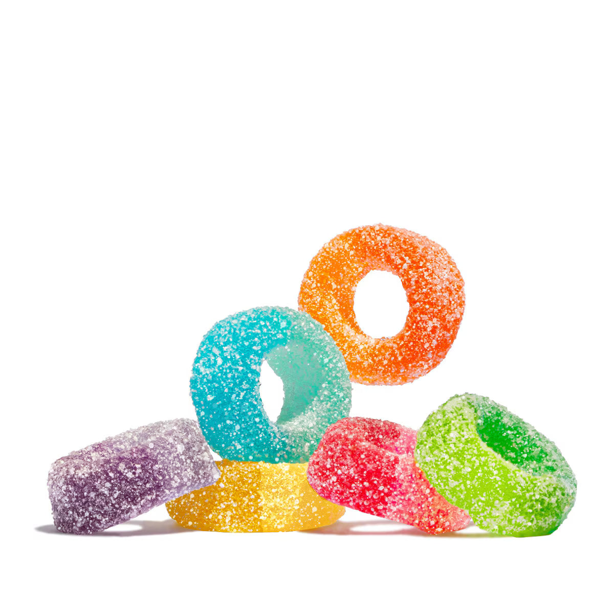 Six colorful ring-shaped gummy candies coated in sugar, arranged in a small pyramid on a plain white background